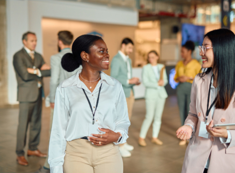 Two women networking at a logistics conference