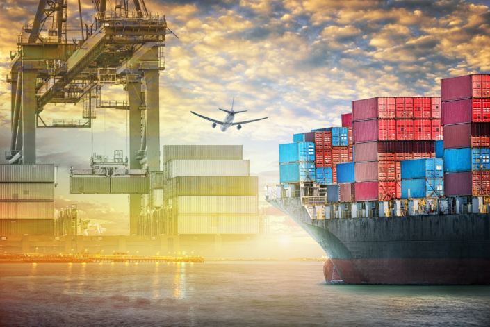 Container cargo ship and cargo plane with port crane bridge in harbor